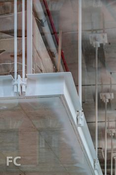 the inside of a building with pipes and wires