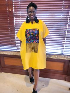 This mini dress features a striking Ankara patch with playful fringes. Perfect for adding a splash of color and flair to any occasion! Available in Yellow, Black, Orange, and white. Regular Size (USA) Fits 8 through 14 Material: Cotton and Ankara Patch with Fringe    Sizes: USA   Regular Size Fits - 8 to 14 (Medium to 1XL)      Colors Available: White Black Orange Yellow Casual Short Sleeve Dress With Fringe, Casual Cotton Fringe Dress, Black Orange, Dress Clothes For Women, Orange Yellow, Yellow Black, Ankara, Orange Black, Color Splash