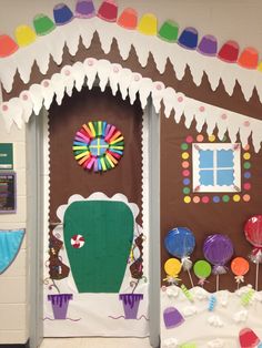 a classroom door decorated with paper plates and candy canes on the front, and an arch in the back