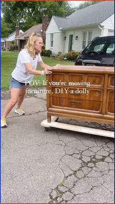 a woman pushing a wooden dresser with the words pov if you're moving furniture diy 4 dolly