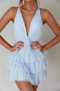 Sky blue mini dress Lined Plunging neckline Tiered frill bodice Criss-cross back Zipper in back You will steal the show in our gorgeous Auguste mini dress. Featuring a plunging neckline and tiered frill bodice. Wear it to a bachelorette or a special birthday celebration. Team it with nude heels and a clutch for a look that'll have you flooded with compliments. MODEL INFO Model is wearing size XS Height: 5'7" Bust: 32" Waist: 24" Hips: 34" SIZE INFO Flat garment measurements This was manually mea Frill Mini Dress, Yellow Bridesmaid Dresses, Yellow Bridesmaids, Veil Hairstyles, Iron Material, Lace Bodycon Dress, Blue Bridesmaids, Date Night Dresses, Blue Mini Dress