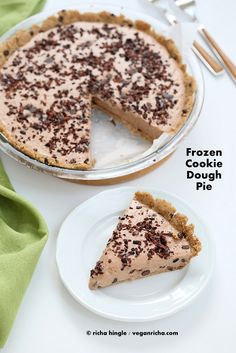 a frozen cookie dough pie on a plate with a slice cut out and ready to be eaten