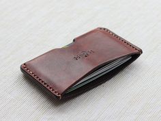 This compact little leather card wallet is ideal for carrying around your essentials while taking up minimal bag and pocket space! Personalisation is Minimalist Bifold Card Holder With Interior Slots, Minimalist Rectangular Business Card Holder, Minimalist Wallets With Card Slots For Daily Use, Minimalist Rectangular Card Holder With Slots, Minimalist Rectangular Card Holder With Card Slots, Minimalist Everyday Card Holder With Coin Pocket, Minimalist Card Holder With Coin Pocket For Everyday, Brown Minimalist Card Holder, Minimalist Brown Card Holder