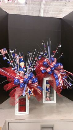 two red, white and blue patriotic decorations on display