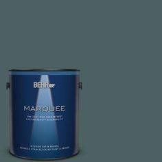 a blue paint can with the word marquee on it's bottom corner