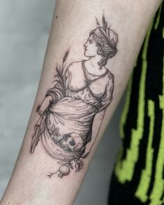 a woman's arm with a tattoo on it