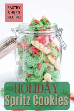 holiday spritz cookies in a glass jar with the words pastry chef's recipe