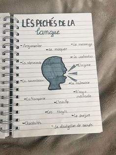 a notebook with writing on it that says les peches de la tongue