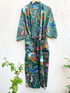 This Robe we makes from 100% Cotton printed fabric. The fabric print is Floral which is very popular in all over the world . We use pure cotton cambric fabric . This is free One size robe . There is both side pocket in robe. Length = 120 cms. ( 48 inches) Green Summer Sleepwear For Home, Green Long Sleeve Sleep Dress, Green Printed Long Sleeve Sleepwear, Fitted Printed Kimono For The Beach, Green Printed Sleepwear For Vacation, Summer Sleepwear Kimono With Prints, Bohemian Green Sleepwear For Summer, Beach Fitted Printed Kimono, Green Bohemian Sleepwear For Summer