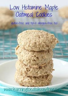 three oatmeal cookies stacked on top of each other in a white plate