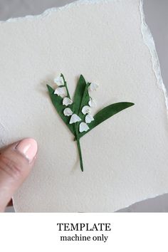 a hand holding a piece of paper with flowers on it and the words template machine only