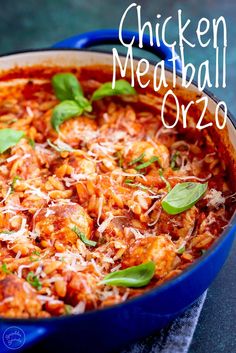 chicken meatball orzo in a blue dish with basil leaves on top and text overlay that reads chicken meatball orzo