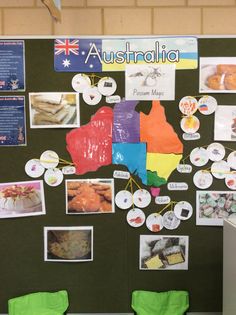 a bulletin board with australia pictures and magnets on it's side, along with green chairs