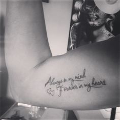 a woman's arm with a tattoo that reads, always on my mind forever in my heart