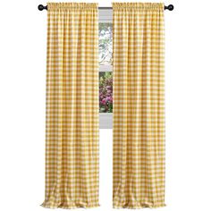 a yellow and white checkered curtain hanging from a window