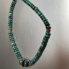 "This top quality gemstone  16\" necklace mesmerizes with enchanting swirls and patterns of deep blues and forest greens engaging with pure copper that has been expertly oxidized to enhance its detail. The necklace closes with a matching copper toggle clasp.  This Chrysocolla comes from Israel, but interestingly the name is a Greek word meaning \"Chrysos\" (gold), and \"Kolla\" (glue).  Also, surprisingly, Chrysocolla is a copper based stone (not gold) and it is formed when copper oxidizes, over Green Gemstone Necklace, London Blue Topaz Earrings, Blue Gemstone Necklace, Gem Drop Earrings, March Birthstone Necklace, Multi Gemstone Necklace, Gemstone Earrings Dangle, Malachite Necklace, Casual Necklaces