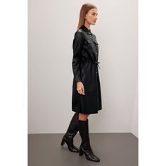 Black faux leather (100% Polyester). A-line. Long sleeve. Collar. Front button closure. 39" from shoulder to hemline. Imported. Fall A-line Belted Midi Dress, Black Knee-length Outerwear For Office, Faux Leather Knee-length Fall Dresses, Faux Leather Knee-length Dresses For Fall, Fall Faux Leather Knee-length Dress, Chic Black A-line Outerwear, Spring Leather Workwear Dress, Leather Midi Dress For Work, Spring Leather Dress For Work