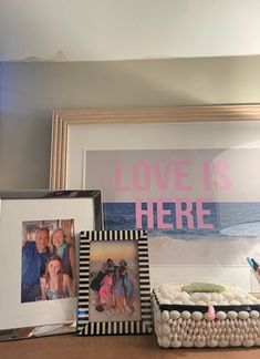 two frames with pictures and an inscription that says love is here