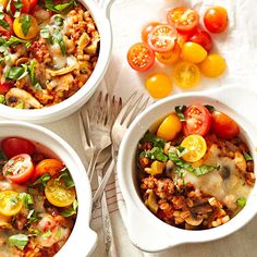 three white bowls filled with different types of food on top of a table next to silverware