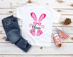 Easter Party Outfit Custom Personalized Easter Gift Idea for Friends Personalized Bunny Shirt, Custom Girl Bunny Shirt, Easter Girl Bunny T-shirt, Easter Kids Tees, Personalized Kid Shirt, Custom Easter Shirts *CUSTOM texts or designs* We do custom orders. Send us your picture or design you'd like to have we will print it! Any design from our shop can be also placed on Kids/Youth shirts, Women V-neck shirts, sweatshirts, hoodies or tanks. Just message us for details! *The shirts are Softstyle Gi Spring Fun T-shirt With Name Print, Cute Short Sleeve Shirt With Name Print, Cute Spring Shirt With Name Print, Pink Short Sleeve Shirt With Name Print, Easter Party Outfit, Personalized Easter Gifts, Easter Shirts, Bunny T Shirt, Easter Bunny Shirts