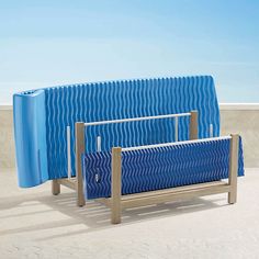 two blue benches sitting next to each other