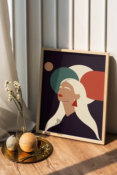 an art print with a woman's face on it next to some vases