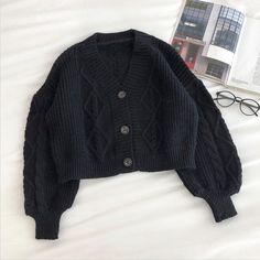 Cropped cardigan with cable knitting. Layer it up with some turtlenecks! Fits S-M 25" across shoulders 44" chest 17" length