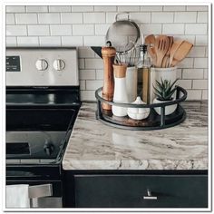 a kitchen counter with utensils and cooking utensils sitting on it's tray