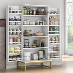 an open pantry with lots of food and drinks on shelves in front of a window