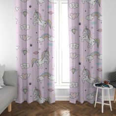 curtains with unicorns and hearts on them in a room next to a window,