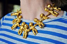 Little gold demon babies attacking this woman's neck? King Cake Baby, Baby Necklace, Mardi Gras Costumes, Mode Inspo, Mardi Gras, Diy Fashion