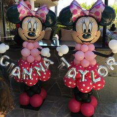 two balloons shaped like minnie and mickey mouses