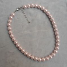 The necklace lengh is 16 inches ,I make the necklace to use 10mm light pink glass pearls,IT has a 2 inches long adjustable chain , IT is good necklace for your great wedding, The picture color is light pink. Can choose other colors are:ivory,white,light pink,Black, red, teal, gray, dark gray, turquoise,green and navy blue. 6-8.5 inches can be used as a bracelet. 12-28 inches can be used for necklaces. Welcome back to my shop: https://www.etsy.com/shop/pearlandjewelry If you need the other lengh Elegant Pink Pearl Beaded Necklace, Pink Pearl Charm Necklace For Formal Occasions, Pink Pearl Charm Necklace For Wedding, Pink Pearl Drop Necklace For Formal Occasions, Formal Pink Pearl Necklace With Pearl Charm, Pink Pearl Bridal Necklace Gift, Pink Pearl Bridal Necklace As A Gift, Formal Pink Pearl Charm Necklace, Formal Pink Pearl Drop Necklace