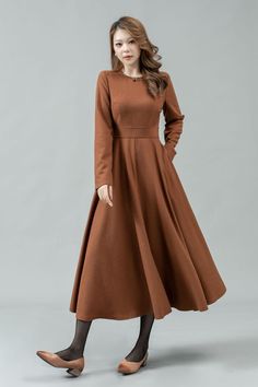 ★★ Welcome to my Ylistyle's shop！！！ This long camel fit and flare wool dress can well show your elegant temperament and taste. Our midi long sleeve wool dress, made of high-quality fabric, giving you a good touch and very comfortable to wear. ★★FEATURES 25% wool, other fiber,nylon Polyester lining Two side pockets Back zipper closure Long sleeves dress Long wool dress Fit and flare dress Dress formal Autumn winter wool dress Dry clean Belt not for sale ★★ More color from Color4 of Wool fabric swatch https://etsy.me/37PMzfD ★★ The model's height approx 170 cm (5′ 7″) with the 84 cm (33") bust, 66 cm (26") waist. She is wearing the wool dress in size XS (US2) ★★Bespoke Order Service Request other color Request the Length Request the sleeve length Your height is not between 155cm- 175cm Your Winter A-line Solid Color Maxi Dress, Plain Fall Midi Dress, Beige A-line Winter Dress, Beige A-line Dress For Winter, Beige A-line Maxi Dress For Fall, Fit And Flare Maxi Dress For Fall, Winter Beige A-line Dresses, Simple Fall Workwear Dresses, Brown Solid Winter Dress