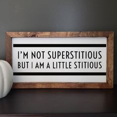 a sign that says i'm not superstitious but i am a little sittiious