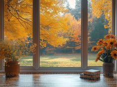 an open window with yellow trees in the background