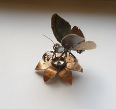 an insect is sitting on top of a flower