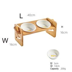 two bowls on a wooden stand with measurements