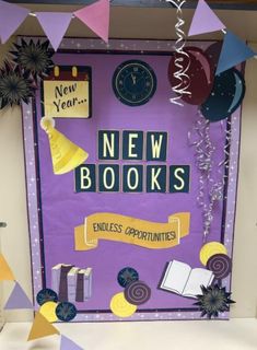 a purple door with new books written on it and decorations around the front, along with confetti streamers