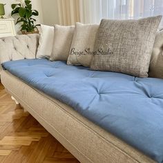 a couch with several pillows on top of it