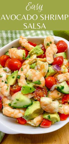 shrimp salad with avocado and tomatoes in a white bowl