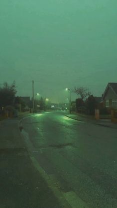 an empty street at night in the rain