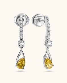 Elegant and timeless, these single-drop earrings feature two fancy yellow diamonds gracefully hanging from a gold bar adorned with pave diamonds. They effortlessly elevate an everyday style or add a touch of glamour to any special occasion. Yellow Diamond Earrings With Diamond Accents, Fine Jewelry Yellow Diamond Earrings, Luxury Yellow Diamond Drop Earrings, Yellow Diamond Earrings For Formal Occasions, Yellow Diamond Earrings In Fine Jewelry Style, Formal Yellow Diamond Earrings, Yellow Diamond Drop Earrings Fine Jewelry, Elegant Yellow Diamond Earrings, Elegant Yellow Diamond Earrings For Formal Occasions