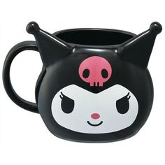 a black and white cat shaped mug with pink skull on it's face is shown