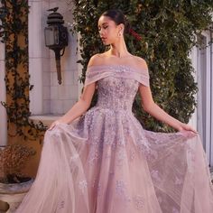 Indulge In Pure Elegance And Captivate All Eyes With Our Stunning English Violet Tulle A-Line Gown. This Breathtaking Gown Features A Delicate Tulle Fabric, A Flattering Off-Shoulder Neckline, Intricate Floral Applique Embellishments, Exquisite Lace Details, And Alluring Elements Like A Removable Sash And A Sleek Zipper Back. Get Ready To Exude Grace And Charm At Any Special Occasion, Leaving A Lasting Impression On Everyone You Meet. Fabric: Tulle Length: Long Color: English Violet Neckline: Of Violet Fantasy Gown, Prom Dresses With Intricate Embroidery On Tulle, Prom Dresses With Intricate Embroidery And Tulle, Intricate Embroidered Tulle Prom Dress, Organza Gala Dress With Intricate Embroidery, Organza Dress With Intricate Embroidery For Gala, Embroidered Tulle Gown, Floor-length, Embroidered Tulle Floor-length Gown, Embroidered Floor-length Tulle Gown