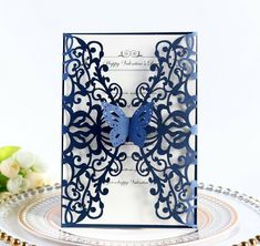 a blue and white card with a butterfly on it