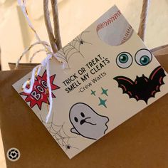 a trick or treat, smell my claws halloween gift bag with stickers on it