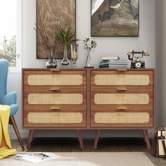 an image of a living room setting with two chairs and a sideboard on the floor