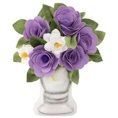 a white vase filled with purple and white flowers