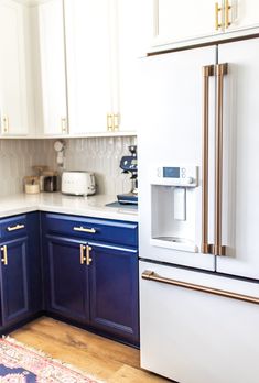 a white refrigerator freezer sitting inside of a kitchen